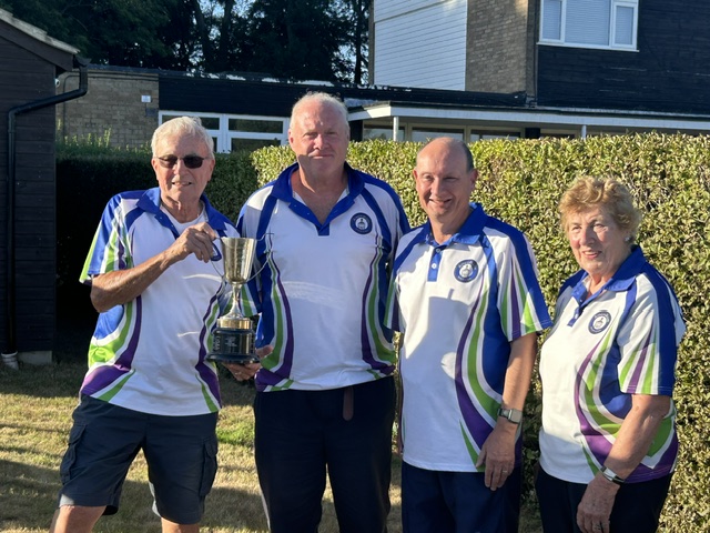 Dave Edwards, Andrew Walker and Ross Panter receiving the trophy from Anne Begley. Geoff Aldridge, Harry Howlett and John Holland were runners up