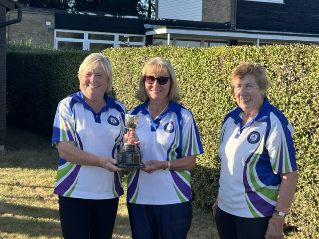 Ladies Pairs winners Delia Panter and Susan Palmer receiving the trophy from Anne Begley. Diane Hilsdon and Lynn Carroll were runners up.